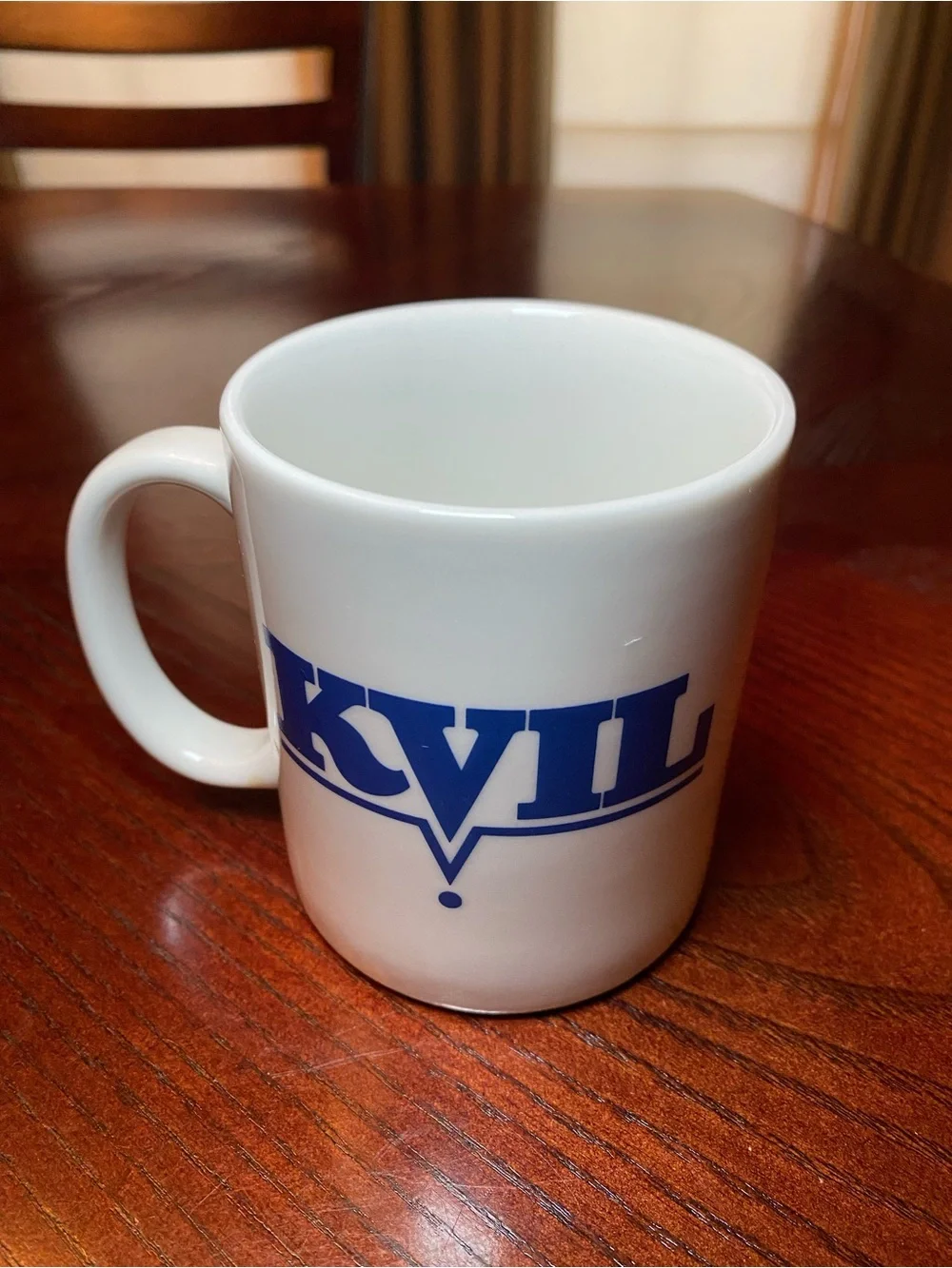 White Ceramic Coffee Mug with Blue KVIL Radio Logo. 10 Oz